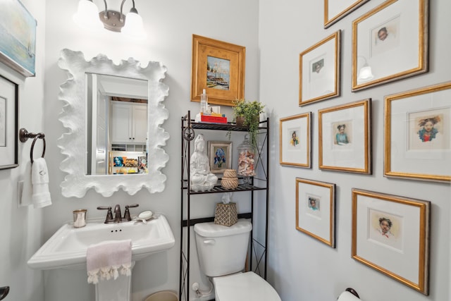 bathroom featuring a sink and toilet