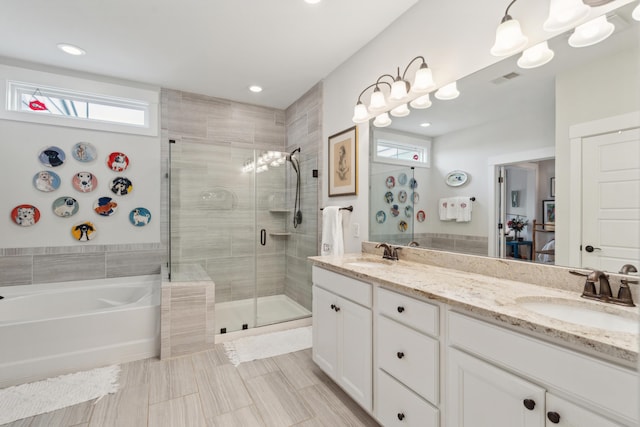 full bathroom with a sink, a garden tub, double vanity, and a shower stall