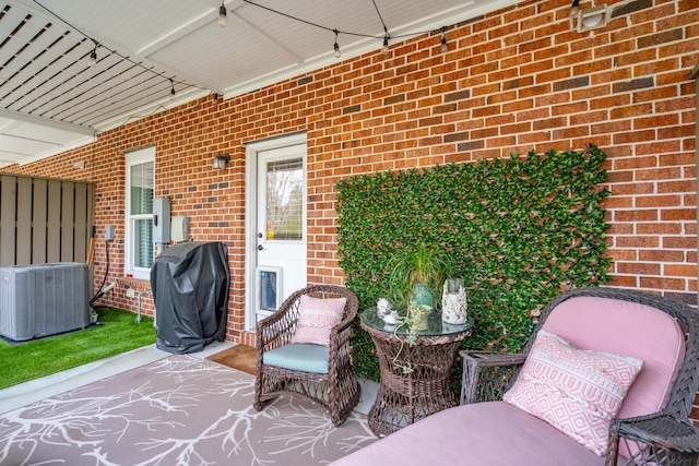 view of patio / terrace with area for grilling and central AC unit