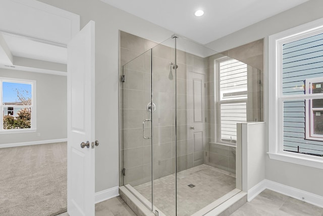 bathroom featuring plenty of natural light and an enclosed shower