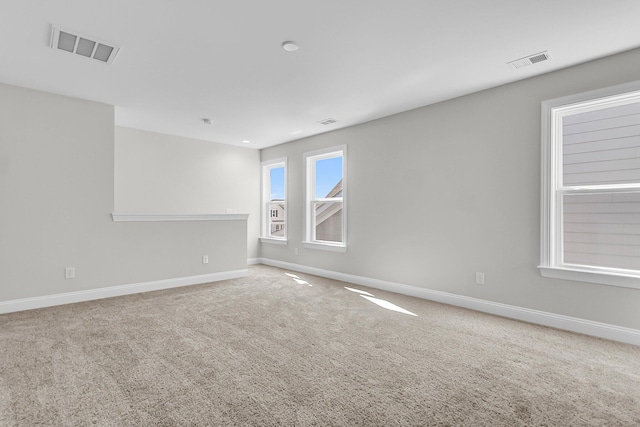 unfurnished room with carpet floors