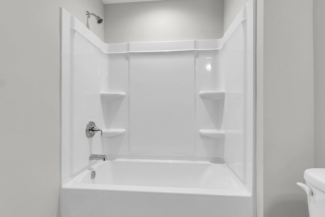 bathroom with shower / bathtub combination and toilet