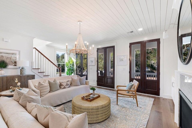 living room with recessed lighting, a chandelier, wood finished floors, stairway, and wood ceiling
