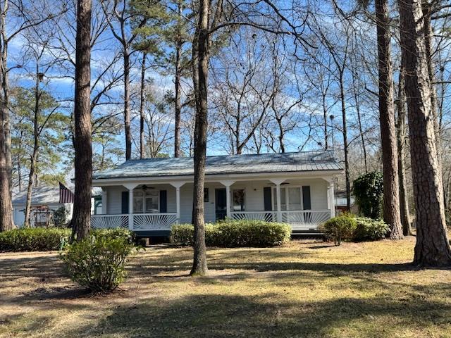 1089 Charles Dr, Manning, SC 29102 - ranch-style home featuring a porch, ceiling fan, and a front yard