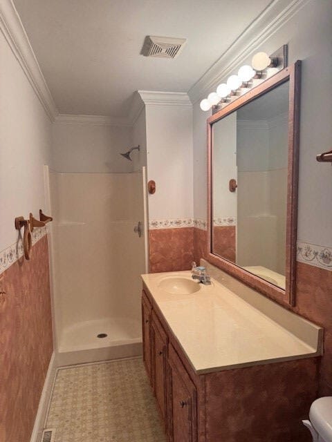 1089 Charles Dr, Manning, SC 29102 - full bathroom featuring a shower, wainscoting, vanity, crown molding, and toilet