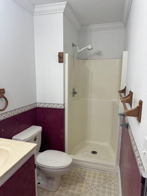 1089 Charles Dr, Manning, SC 29102 - bathroom featuring vanity, crown molding, walk in shower, and toilet