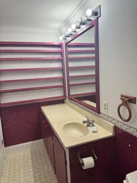 1089 Charles Dr, Manning, SC 29102 - half bathroom featuring vanity, toilet, tile patterned floors, ornamental molding, and baseboards
