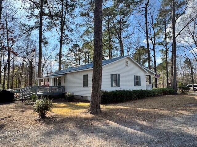 1089 Charles Dr, Manning, SC 29102 - view of property exterior featuring crawl space and a wooden deck