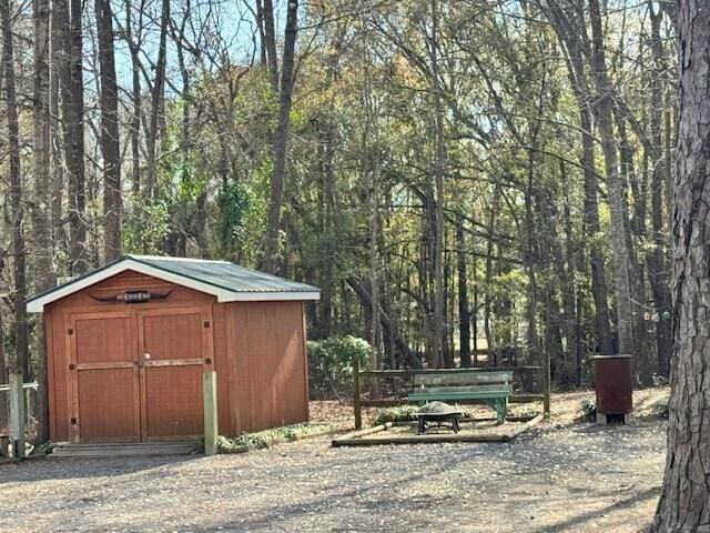 1089 Charles Dr, Manning, SC 29102 - view of shed featuring a forest view