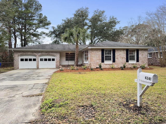 ranch-style house with an attached garage, brick siding, concrete driveway, and a front yard