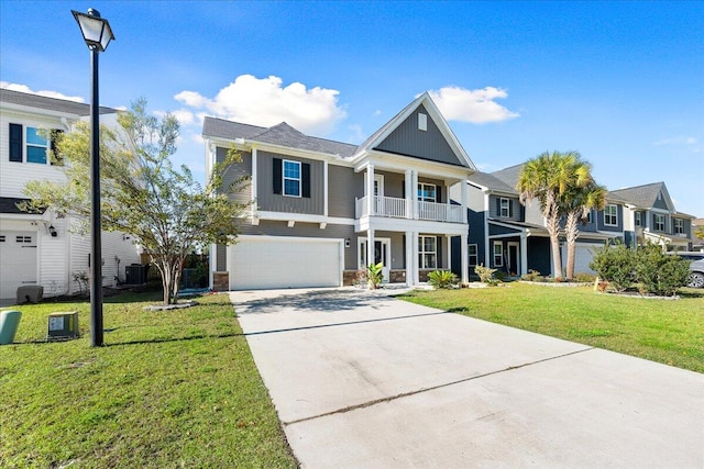 view of front of property with cooling unit, a balcony, a front lawn, and a garage