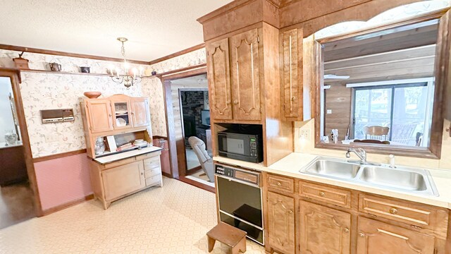 1807 Perch Rd, Moncks Corner, SC 29461 - kitchen featuring wallpapered walls, black appliances, crown molding, light countertops, and a textured ceiling