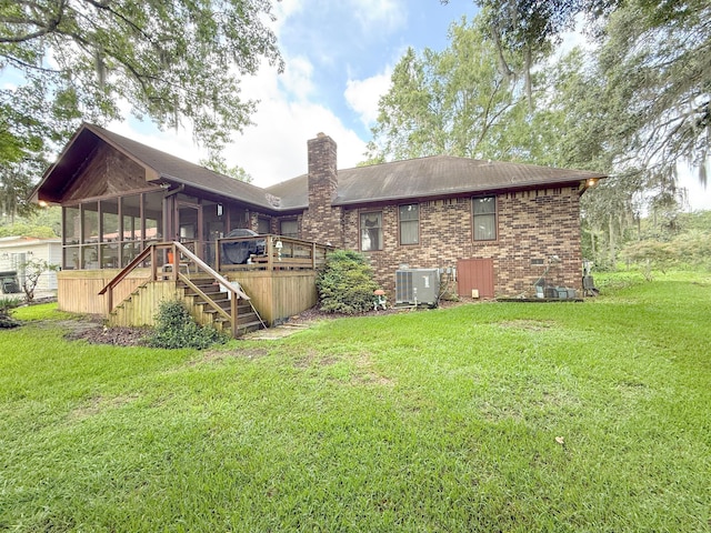 1807 Perch Rd, Moncks Corner, SC 29461 - back of property with a sunroom, stairway, a chimney, brick siding, and a lawn