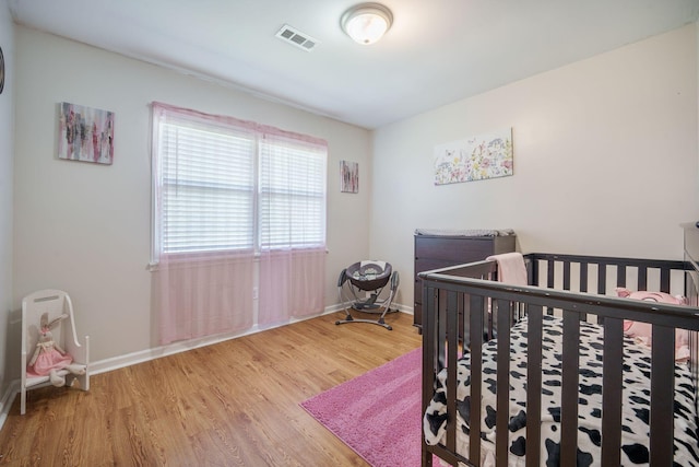 208 Mini Farm Rd, Bonneau, SC 29431 - bedroom with visible vents, baseboards, and wood finished floors