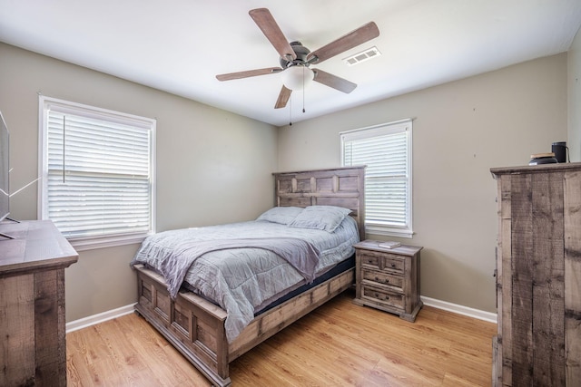 208 Mini Farm Rd, Bonneau, SC 29431 - bedroom featuring visible vents, light wood-type flooring, baseboards, and ceiling fan