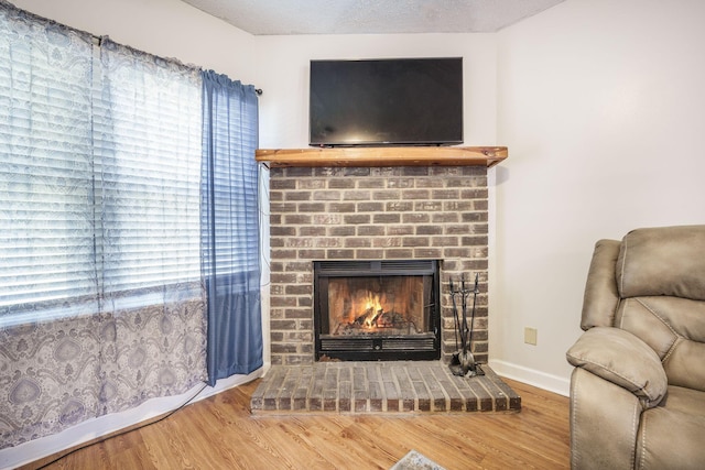 208 Mini Farm Rd, Bonneau, SC 29431 - living area featuring baseboards, plenty of natural light, wood finished floors, and a fireplace