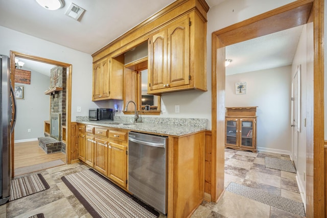 208 Mini Farm Rd, Bonneau, SC 29431 - kitchen with light stone countertops, visible vents, appliances with stainless steel finishes, a sink, and baseboards
