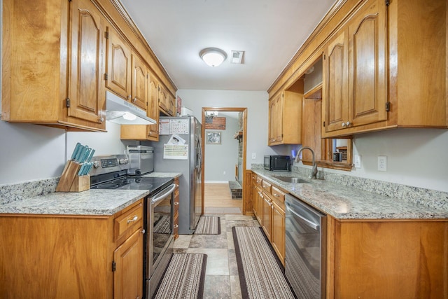208 Mini Farm Rd, Bonneau, SC 29431 - kitchen with a sink, brown cabinetry, appliances with stainless steel finishes, and under cabinet range hood