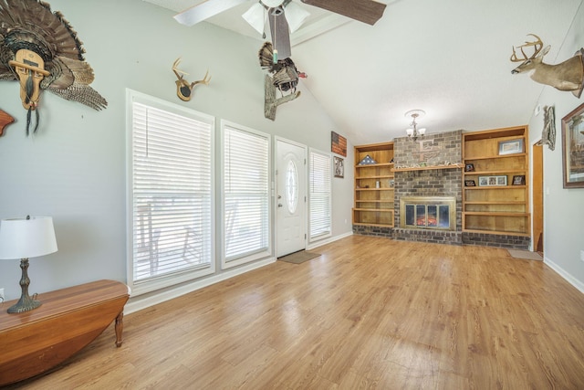208 Mini Farm Rd, Bonneau, SC 29431 - living area with baseboards, a brick fireplace, ceiling fan, wood finished floors, and vaulted ceiling with beams