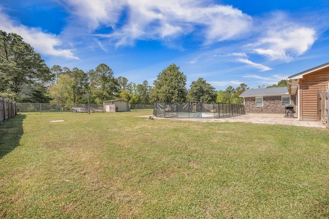 208 Mini Farm Rd, Bonneau, SC 29431 - view of yard featuring a patio area, a fenced backyard, a fenced in pool, and an outbuilding
