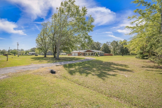 208 Mini Farm Rd, Bonneau, SC 29431 - view of front of home with a front yard and gravel driveway