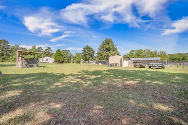 208 Mini Farm Rd, Bonneau, SC 29431 - view of yard with fence and an outbuilding