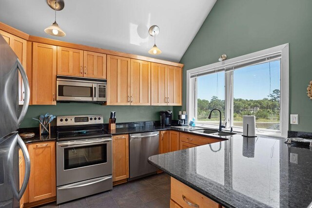 2473 High Hammock Rd, Seabrook Island, SC 29455 - kitchen with appliances with stainless steel finishes, lofted ceiling, a sink, decorative light fixtures, and dark tile patterned flooring