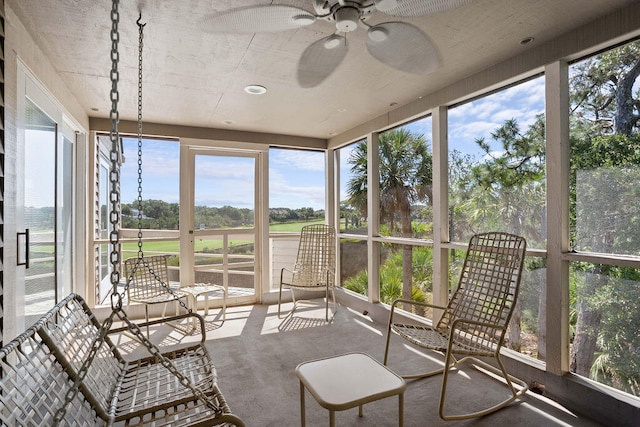 sunroom / solarium with ceiling fan