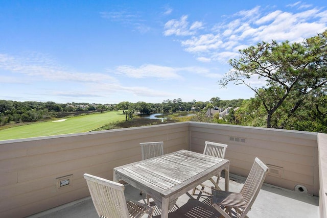 2473 High Hammock Rd, Seabrook Island, SC 29455 - balcony featuring outdoor dining space, a water view, and view of scattered trees