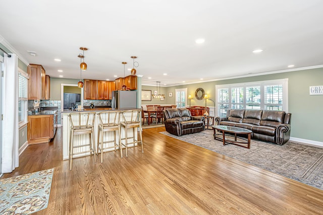 762 Swanson Ave, Charleston, SC 29412 - living room featuring wood finished floors, recessed lighting, and crown molding