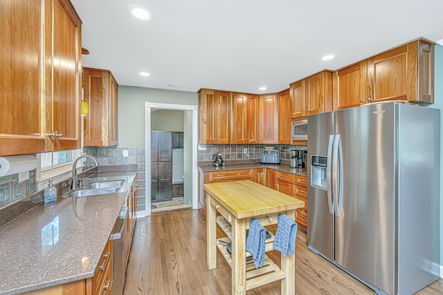762 Swanson Ave, Charleston, SC 29412 - kitchen featuring stainless steel appliances, light wood-type flooring, brown cabinets, and recessed lighting