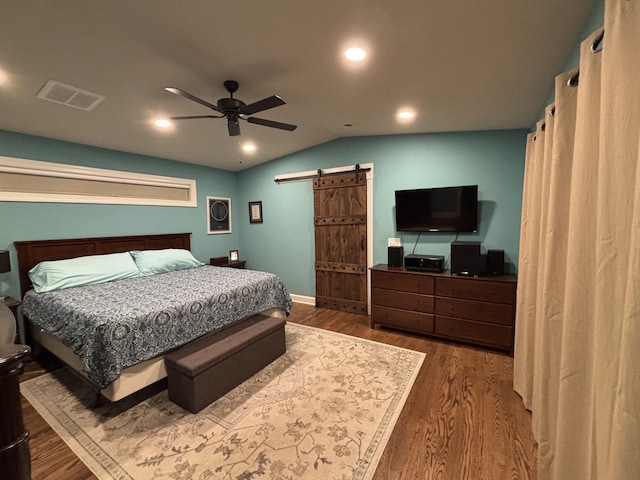 762 Swanson Ave, Charleston, SC 29412 - bedroom with a barn door, vaulted ceiling, dark wood-style flooring, a ceiling fan, and recessed lighting