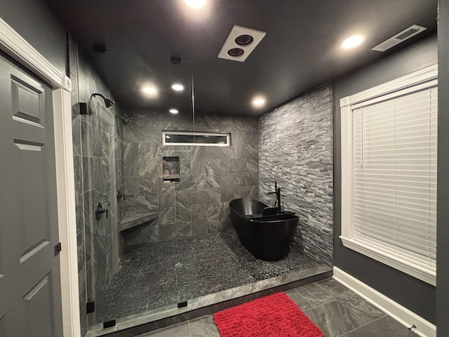 762 Swanson Ave, Charleston, SC 29412 - bathroom featuring tiled shower, recessed lighting, and marble finish flooring