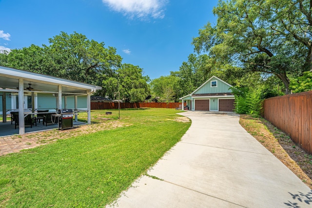 762 Swanson Ave, Charleston, SC 29412 - fenced backyard with a detached garage, an outbuilding, and ceiling fan