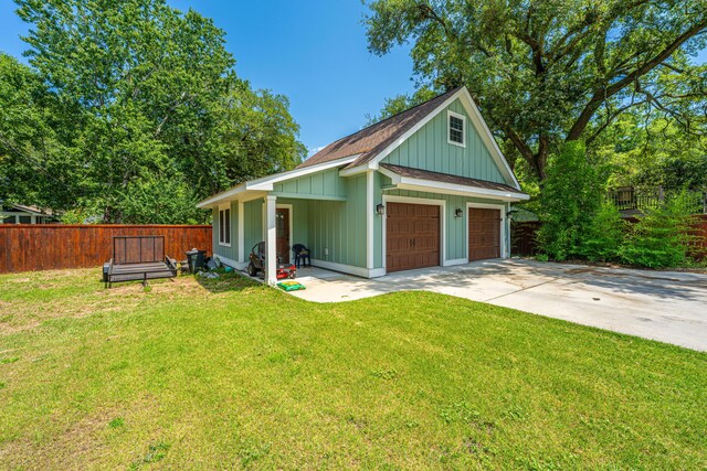 762 Swanson Ave, Charleston, SC 29412 - view of front facade with board and batten siding and a garage
