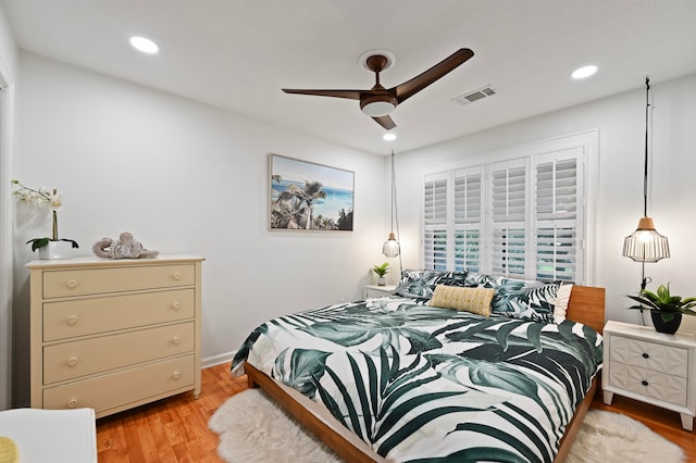 bedroom featuring light hardwood / wood-style floors and ceiling fan