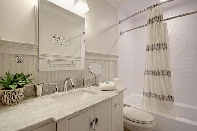 full bathroom with shower / tub combo, vanity, and toilet