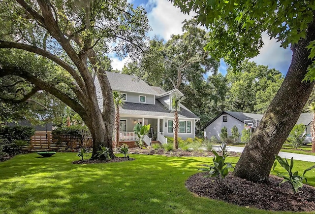 view of front of house with a front lawn and covered porch