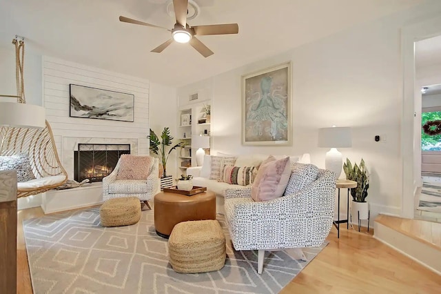 living room with hardwood / wood-style floors and ceiling fan