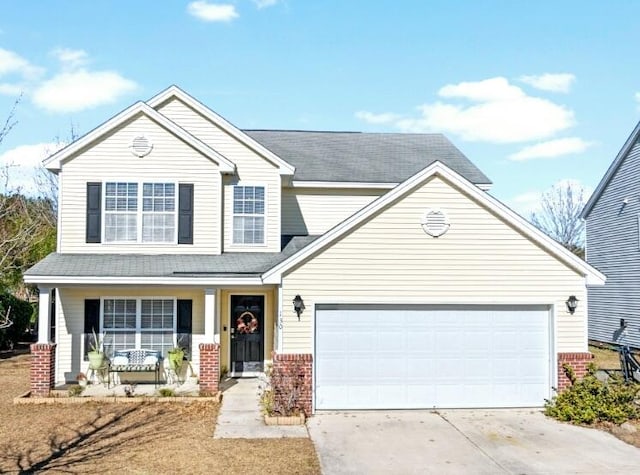 view of front of home with a garage and a porch