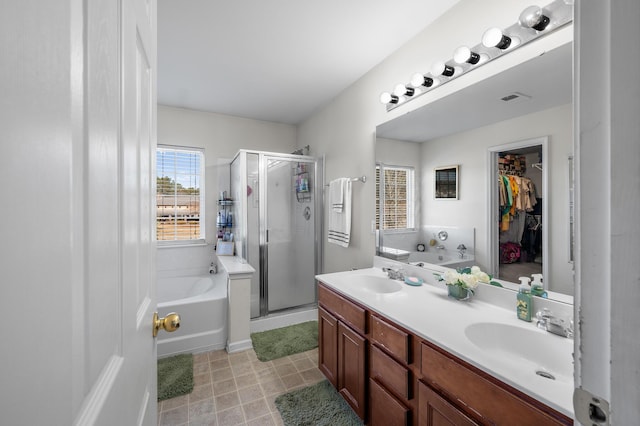 bathroom with plus walk in shower and vanity