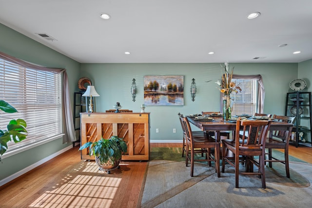 dining area featuring a healthy amount of sunlight and wood-type flooring