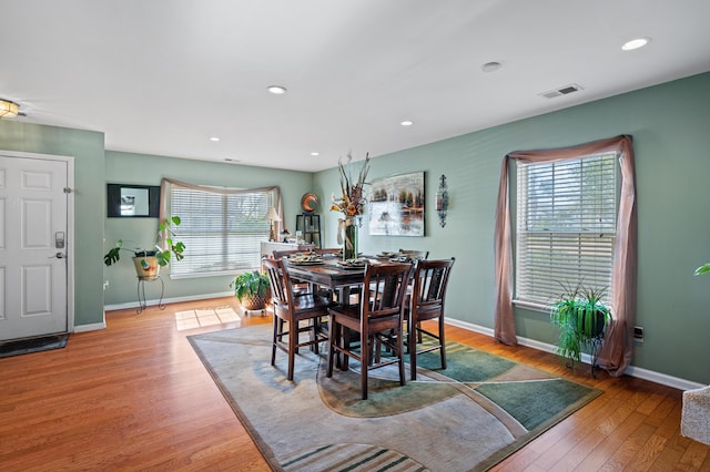 dining space featuring light hardwood / wood-style floors and a healthy amount of sunlight