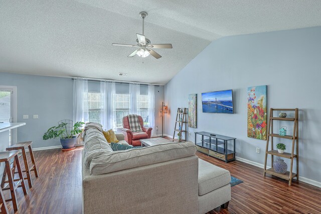 210 Delafield Dr, Summerville, SC 29483 - living room featuring ceiling fan, a textured ceiling, wood finished floors, baseboards, and vaulted ceiling