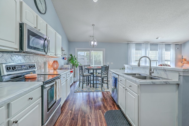 210 Delafield Dr, Summerville, SC 29483 - kitchen featuring appliances with stainless steel finishes, a sink, a textured ceiling, light countertops, and white cabinetry