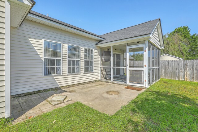 210 Delafield Dr, Summerville, SC 29483 - back of house featuring a sunroom, a patio, and roof with shingles