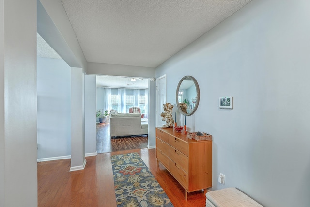 210 Delafield Dr, Summerville, SC 29483 - hall with wood finished floors, a textured ceiling, and baseboards