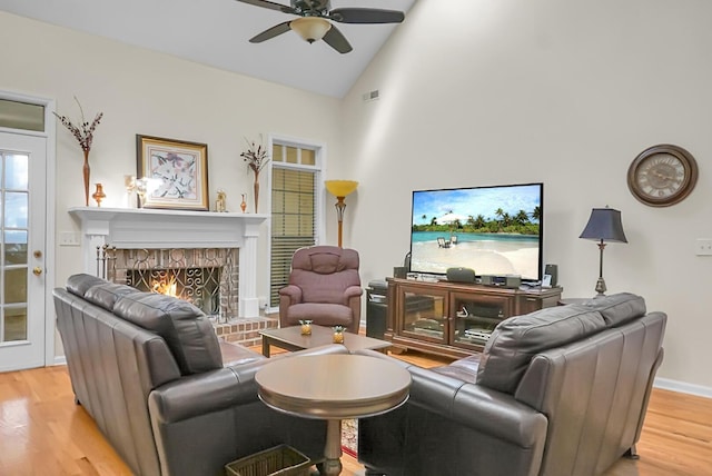 652 Spinner Cir, Mount Pleasant, SC 29464 - living area featuring wood finished floors, a ceiling fan, a fireplace, and high vaulted ceiling