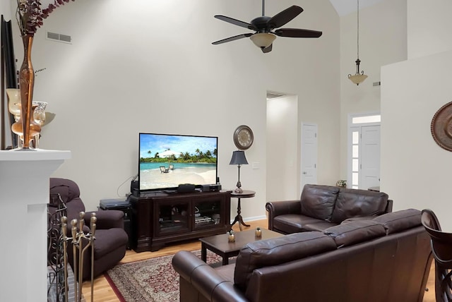 652 Spinner Cir, Mount Pleasant, SC 29464 - living room with light wood-style flooring, ceiling fan, and high vaulted ceiling