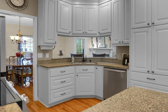 652 Spinner Cir, Mount Pleasant, SC 29464 - kitchen with dishwasher, a chandelier, light wood-style floors, and white cabinets